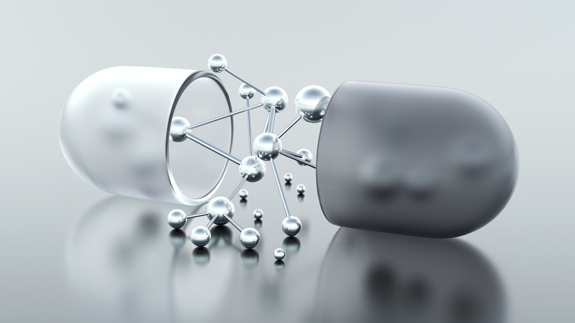 Open capsule or pill with molecular structure